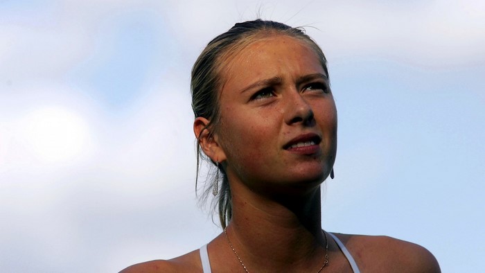 Maria Sharapova looking up against a blue sky