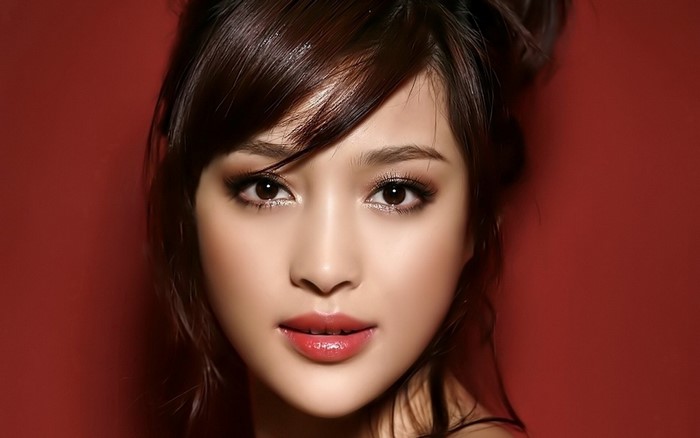 Beautiful Asian Woman Portrait with Red Background