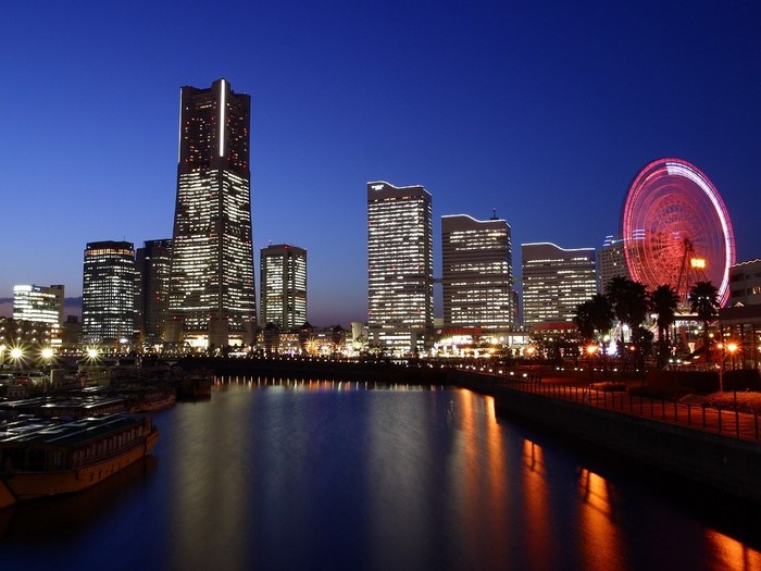 Yokohama cityscape at night with ferris wheel and skyscrapers