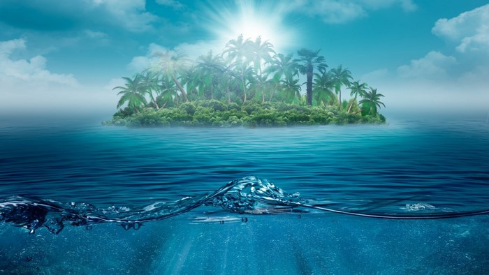 Tropical island in the ocean with sunlight and underwater view