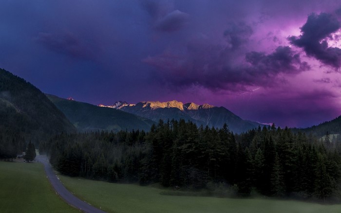 Lightning storm over the Alps at dusk