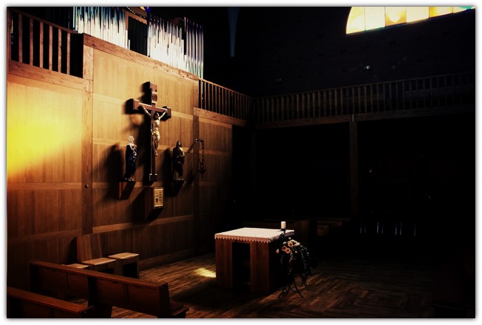 Interior of a church with a crucifix and altar
