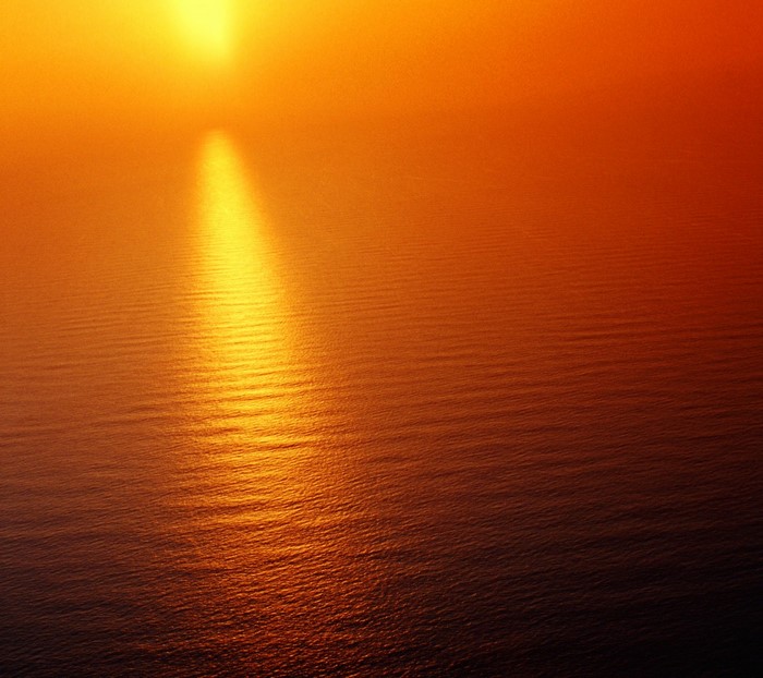 Sunlight reflecting on the ocean at sunset