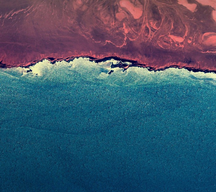 Aerial view of a coastline at sunset