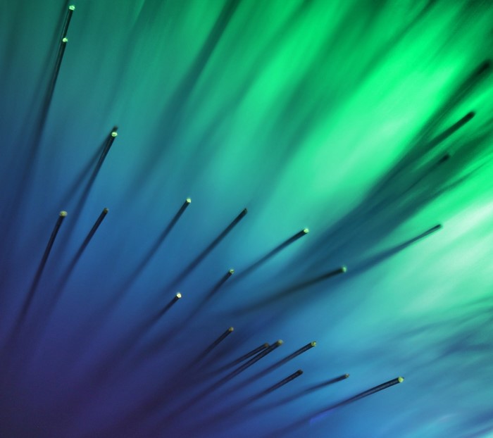 Close-up of optic fibers with blue and green light