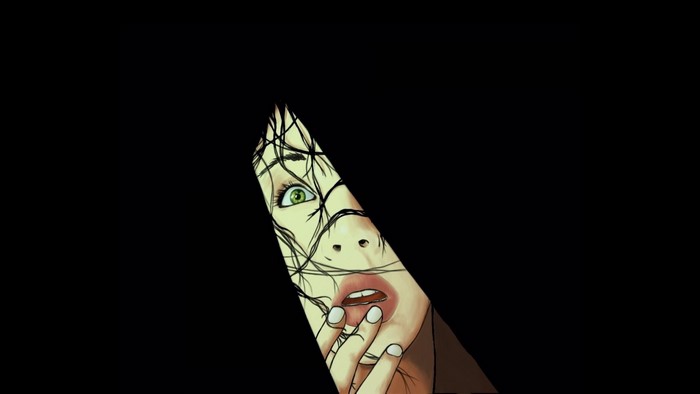 Close up of a woman's face peeking through darkness