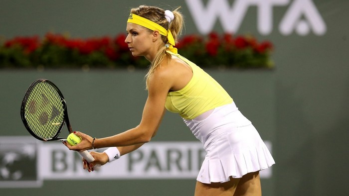 Maria Kirilenko serving tennis ball at WTA tournament