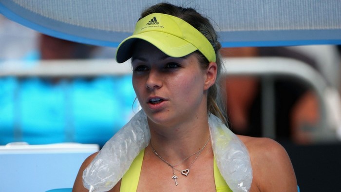 Maria Kirilenko wearing an Adidas visor and necklace