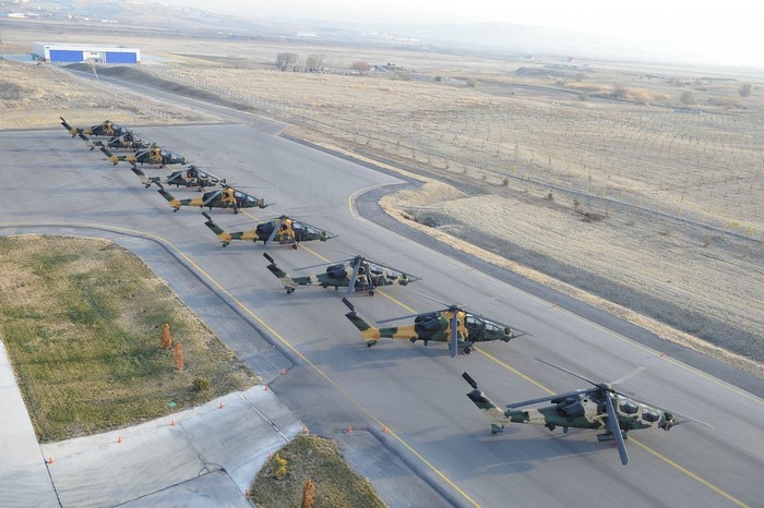 Turkish T129 ATAK helicopters lined up on a runway