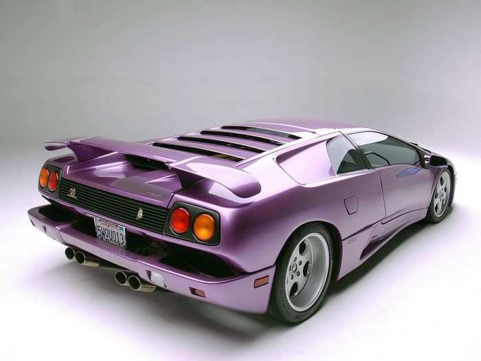 Purple Lamborghini Diablo SV with a rear spoiler