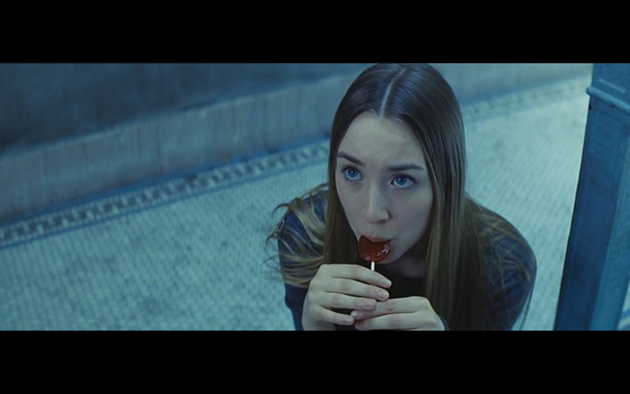 Saoirse Ronan eating a lollipop
