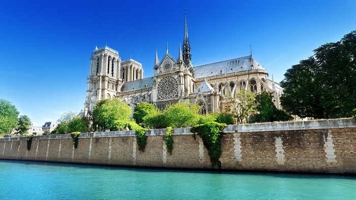 Notre Dame Cathedral by the Seine River in Paris