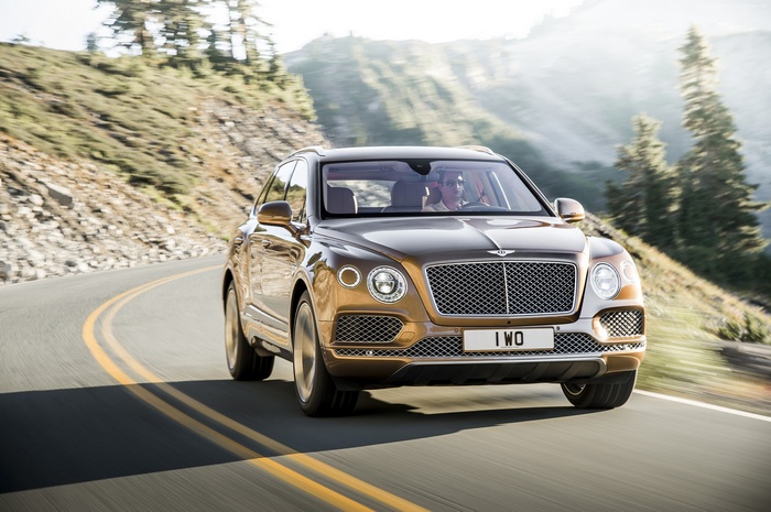 Bentley Bentayga driving on a mountain road