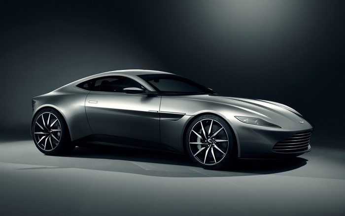 Silver Aston Martin DB10 sports car on a dark background
