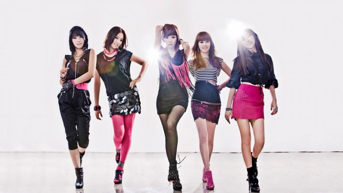 Five fashion models posing in stylish outfits