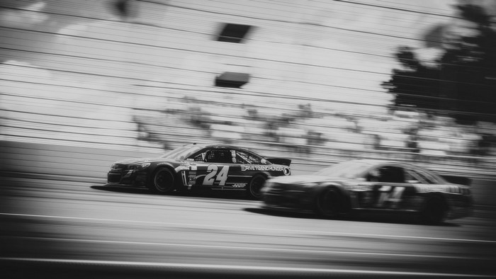 Two Nascar race cars on a track, motion blur