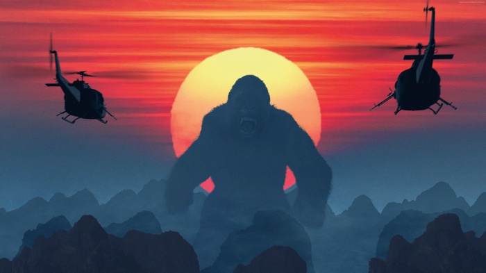 King Kong and helicopters at sunset