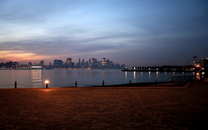 New York City skyline at dusk over the water