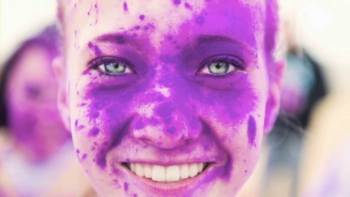 Close up of a girl with purple powder on her face