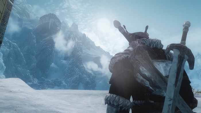 Khajiit warrior with sword in snowy mountains of Skyrim