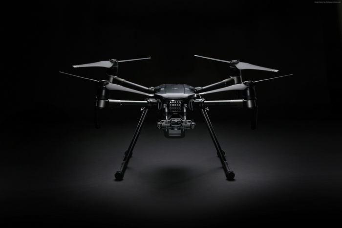 DJI M200 drone on a black background