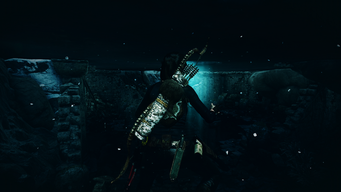 Lara Croft from Rise of the Tomb Raider in a dark environment