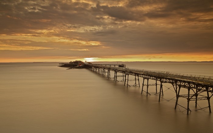Pier over the sea at sunset