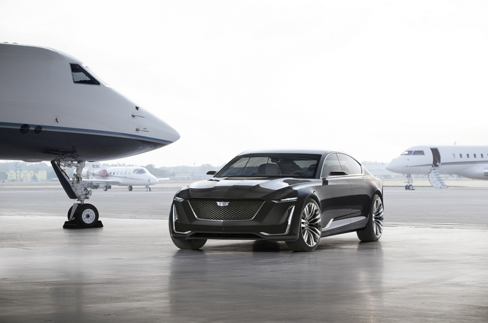Cadillac Escala concept car on tarmac with private jets