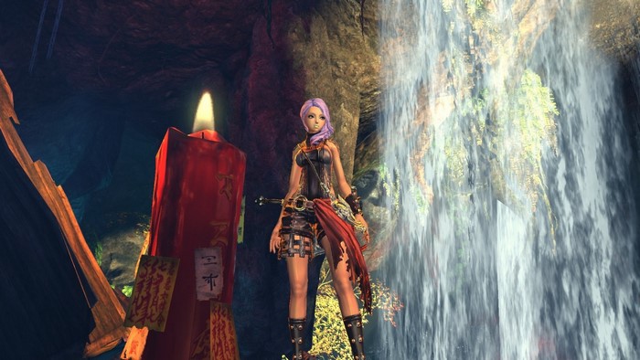 Woman in fantasy armor near waterfall and candle