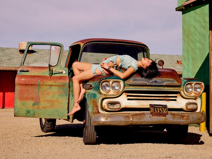 Model Posing on Vintage Rusted Truck
