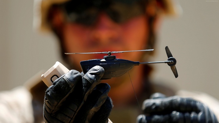 Soldier holding Black Hornet Nano military drone