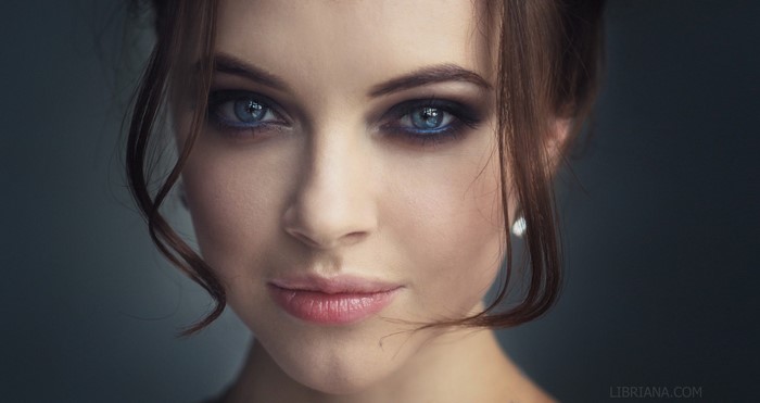 Portrait of a Woman with Blue Eyes and Smoky Makeup