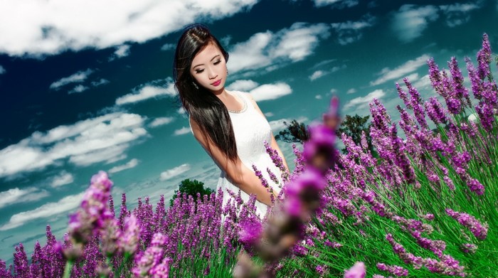 Woman in white dress in lavender field