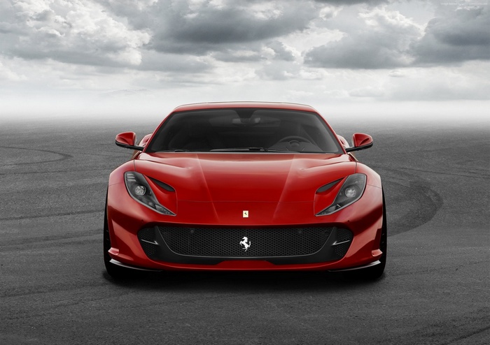 Red Ferrari 812 Superfast on asphalt