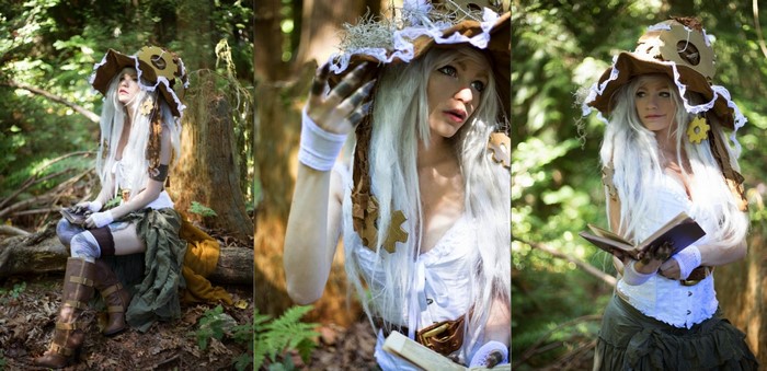 Woman in witch costume in forest with book