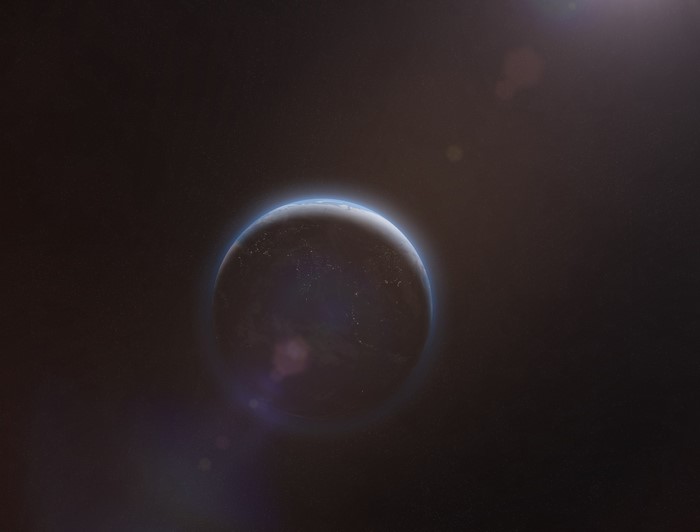 Planet in space with atmosphere and lens flare