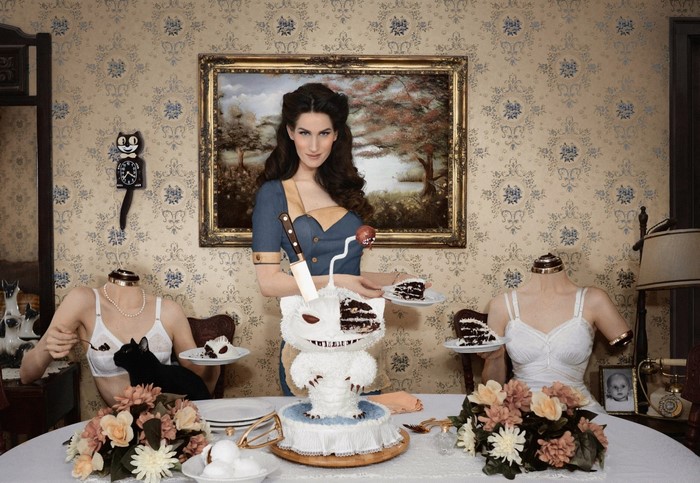 Christine H McConnell serving cake to headless mannequins