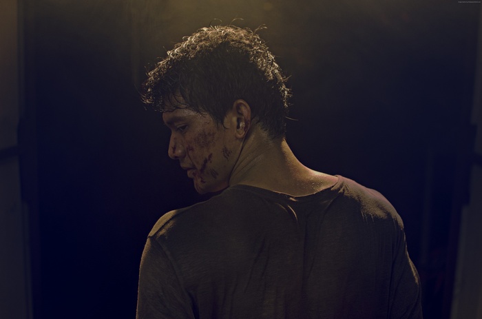 Iko Uwais in a dark setting