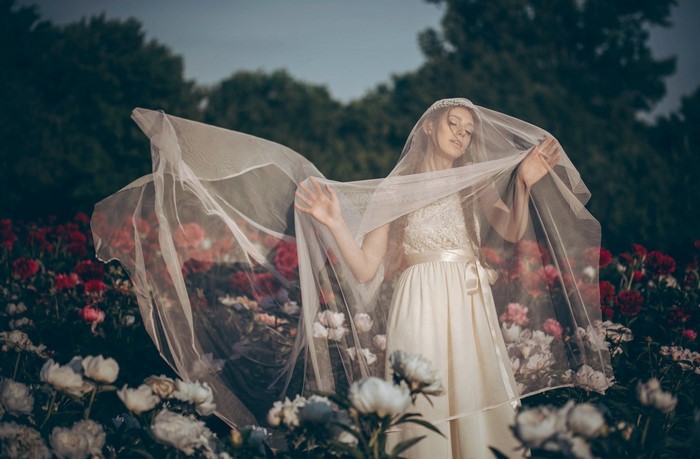 Bride in a floral garden with veil