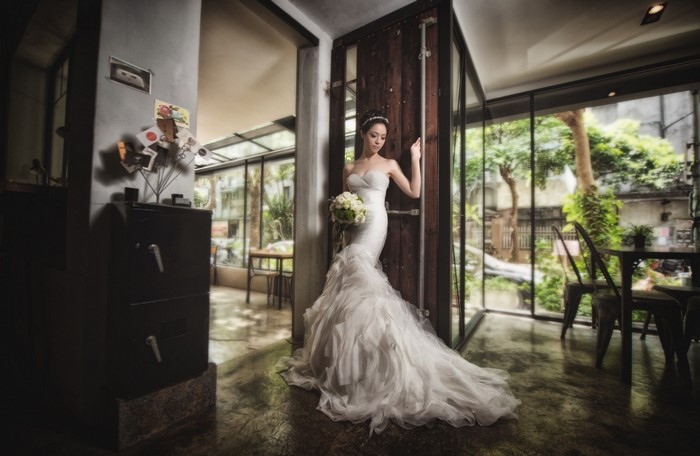 Bride in a white wedding dress holding a bouquet