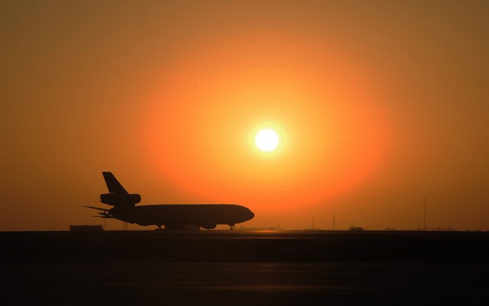 Silhouette of a McDonnell Douglas KC-10 Extender aircraft at sunset
