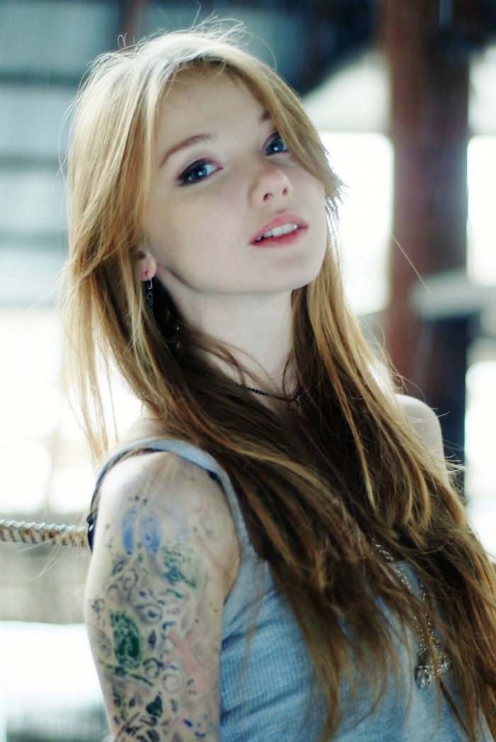 Portrait of a Redhead Woman with Tattoos