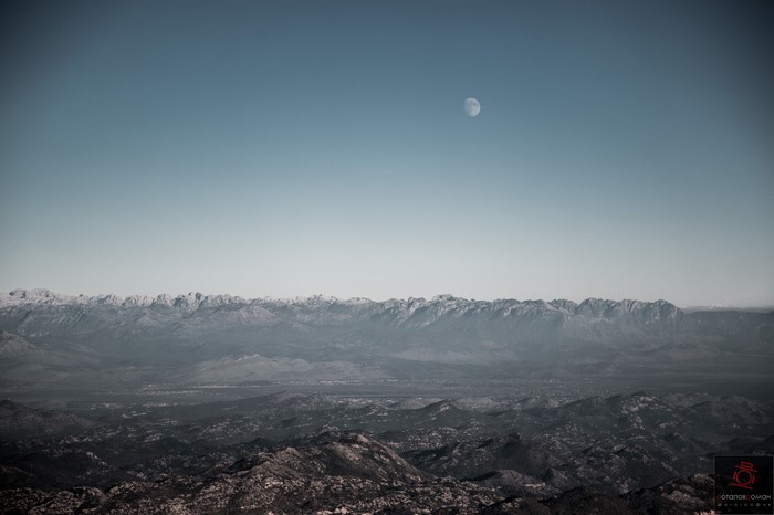 Moon over mountain range and foothills