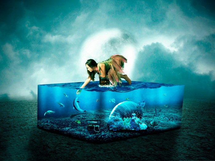 Woman reaching into a surreal underwater world