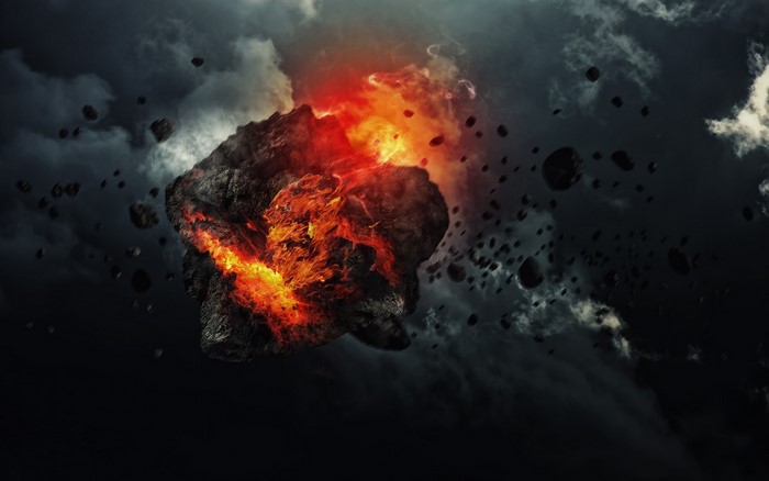 Exploding asteroid in outer space with debris