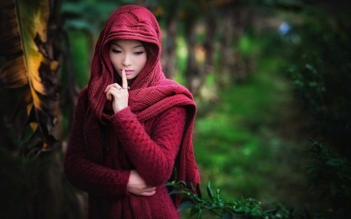 Woman in Red Hooded Sweater in a Forest