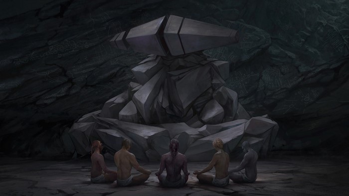 People meditating in a cave with ancient carvings