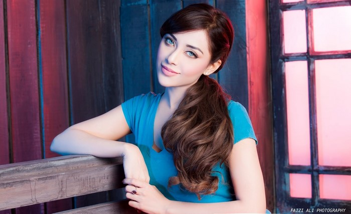 Model with Long Brown Hair in Blue Dress