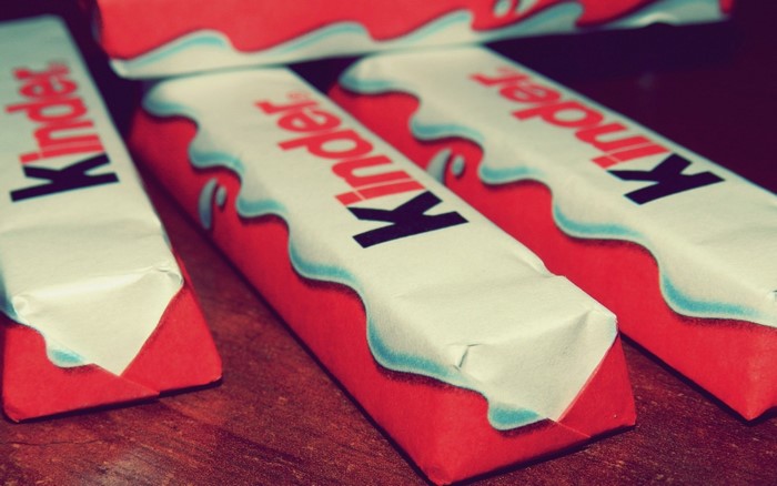 Kinder chocolate bars on a wooden surface