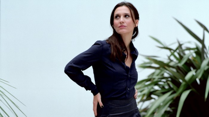 Jayne Middlemiss in a dark blue shirt and black skirt